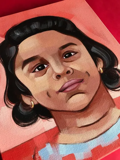 A commissioned acrylic portrait of Jiza. ❤️ I used a warm, red background to complement her features and create a painting that is full of life and personality.