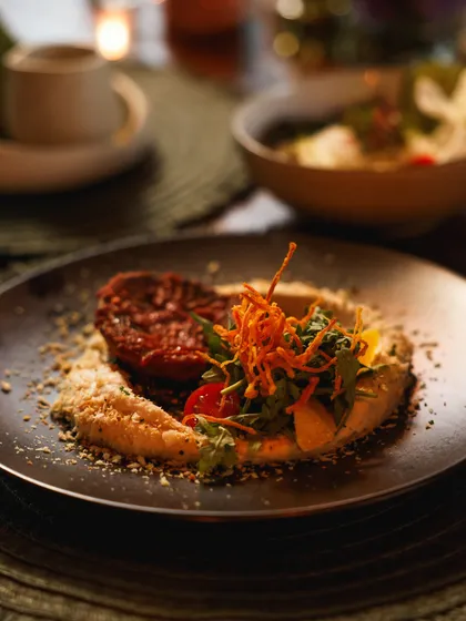 A beautifully plated Mediterranean dish, showcasing our focus on fresh ingredients and artistic presentation.