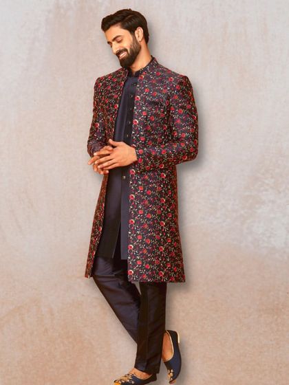 A full view of this striking floral sherwani. Paired with a simple dark kurta and trousers, the jacket becomes the centerpiece of the outfit.