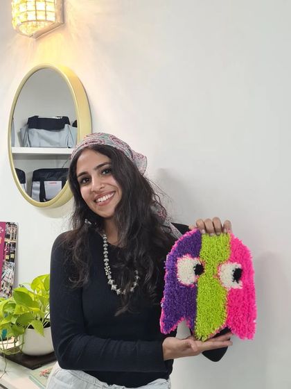 This student created the cutest Pac-Man ghost rug in her class. It's a great example of how you can bring retro and pop culture icons to life with tufting.