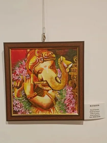 A close-up of my framed 'Murali Ganesha' on display. This 12x12 inch acrylic on canvas is a perfect example of a smaller, detailed piece of spiritual art that can be a wonderful gift or addition to a personal altar.