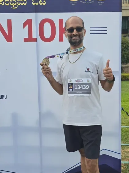 Celebrating a successful 10k run with a well-earned medal.