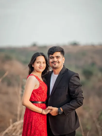A classic couple portrait from an outdoor pre-wedding shoot, capturing their happy smiles and connection.