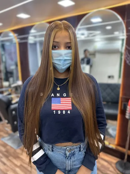 A front view of the global color and highlights, showing how it brightens up the client's whole look.