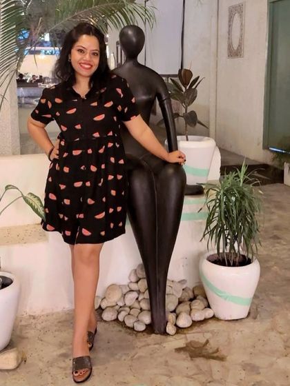 Adding a touch of fun to your wardrobe with this watermelon-print shirt dress. It's a playful and comfortable choice for a casual day.