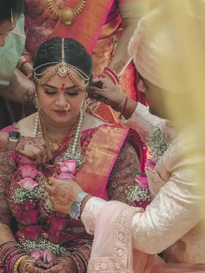 Another beautiful ritual shot, showing the intricate details of the bride's attire and jewellery.