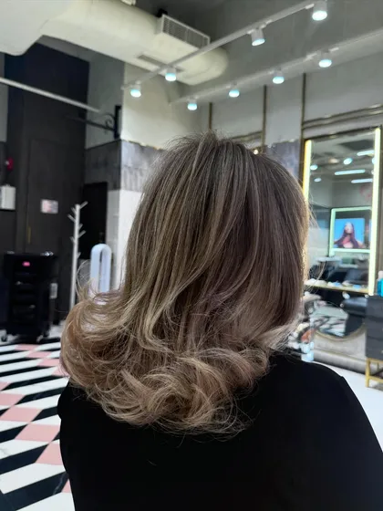 A still shot of this cool and classy blonde. The color is a perfect balance of cool tones, creating a sophisticated and modern look.