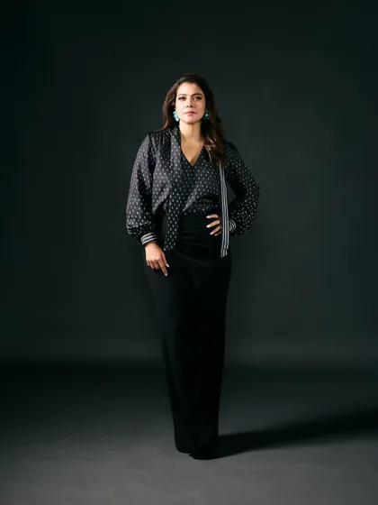 A full-length view of the black printed ensemble, a sophisticated and modern choice for the 'Do Patti' promotions.