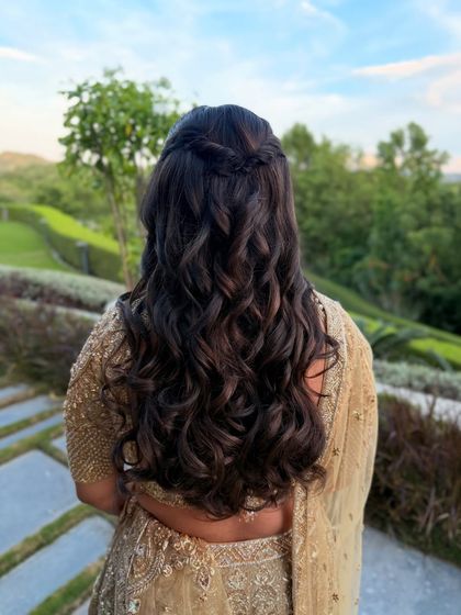 Another shot of the simple half-up twist, set against a beautiful green landscape.