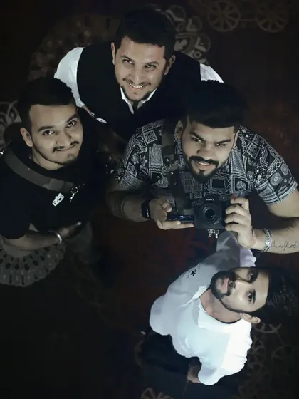 A creative top-down view of me and my photography team, ready for action. We work together seamlessly to cover every angle of your event, ensuring no moment is missed.