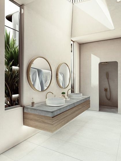 This spacious bathroom in the Pavilions in the Fields project includes a walk-in wardrobe and a skylit shower. The design uses a light, neutral palette and brings in greenery through a courtyard window, creating a serene and expansive feel.