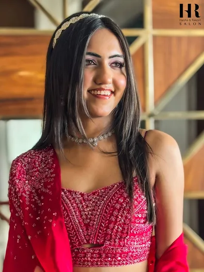 This party-ready look is perfect for a sangeet or cocktail night. The makeup is glamorous yet sophisticated, with a focus on radiant skin and defined eyes that will make you shine.