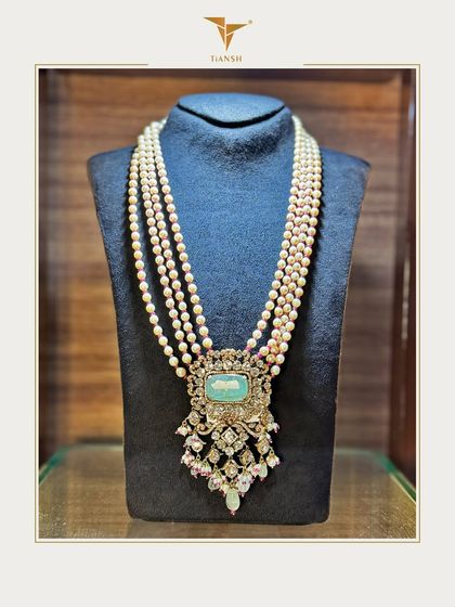 Grace in every strand, legacy in every detail. This heritage pearl haar, crowned with a majestic emerald and Polki pendant, is crafted for the moments that become lifelong memories.