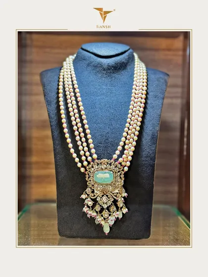 Grace in every strand, legacy in every detail. This heritage pearl haar, crowned with a majestic emerald and Polki pendant, is crafted for the moments that become lifelong memories.