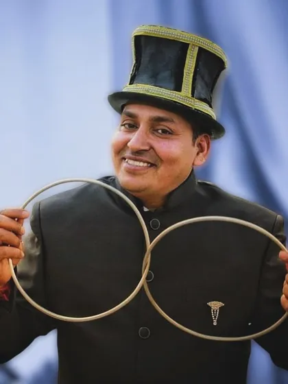 A portrait of me with the classic linking rings. This is one of the most elegant and baffling illusions in magic, and a personal favorite to perform.