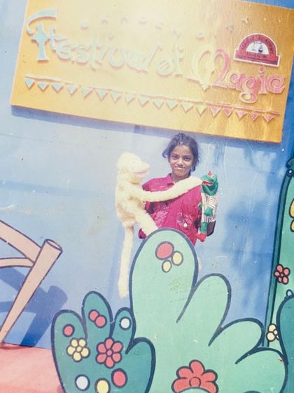 A precious throwback to where it all began. This is me as a little girl at a 'Festival of Magic', holding one of my very first puppets. My passion for this art started very early.
