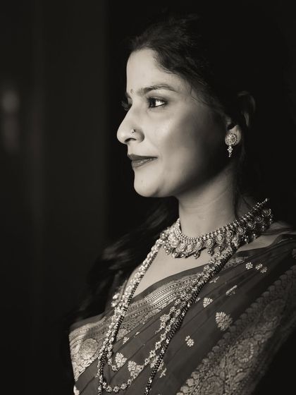 An elegant black and white profile portrait of the bride.