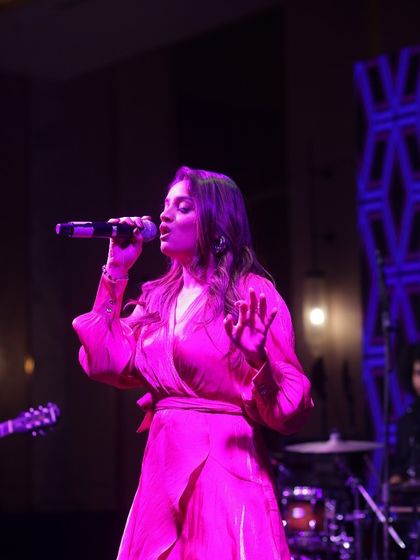 A close-up shot from my Chandigarh show, bathed in pink light. The stage lighting is always designed to match the mood of the song.