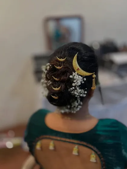 Another angle of the classic bridal bun, showing the placement of the 'gajra' and accessories.