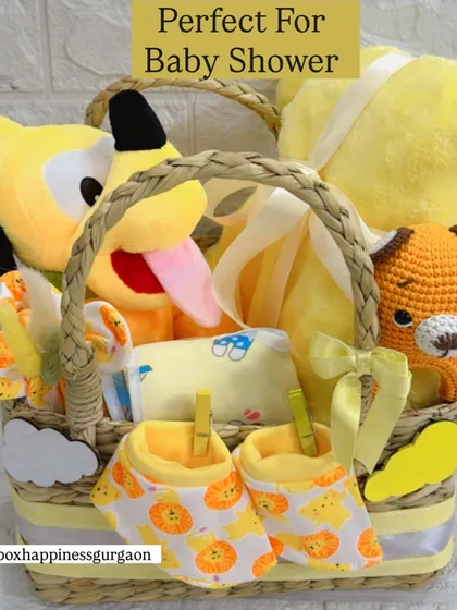 A beautifully composed shot of the yellow-themed baby shower basket, showing how each item is carefully arranged to create a visually appealing and exciting gift.