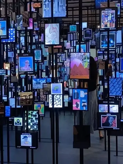 We explore how art is consumed in the digital age through our 'Artify' installation. This space visualizes a metaverse of possibilities, creating a dense forest of screens displaying NFTs. It is a physical manifestation of the digital art landscape, questioning the boundaries between the virtual and the real.