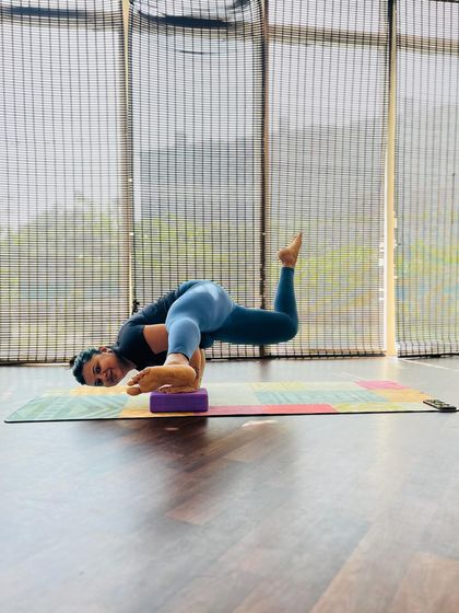 Here my student uses a block to support her in a challenging arm balance. Props are wonderful tools to help us understand the mechanics of a pose and build strength safely.