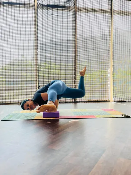 Here my student uses a block to support her in a challenging arm balance. Props are wonderful tools to help us understand the mechanics of a pose and build strength safely.