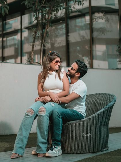 A beautiful, interactive portrait where the couple is lost in their own world. The genuine smiles and eye contact make this photo feel incredibly personal and real.
