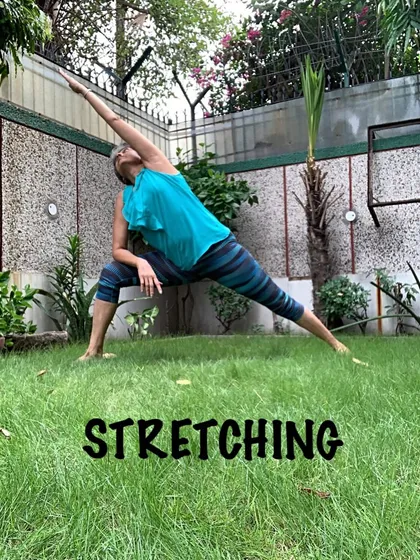 Practicing a deep side angle stretch outdoors. The fresh air and natural surroundings enhance the energizing effects of the pose.