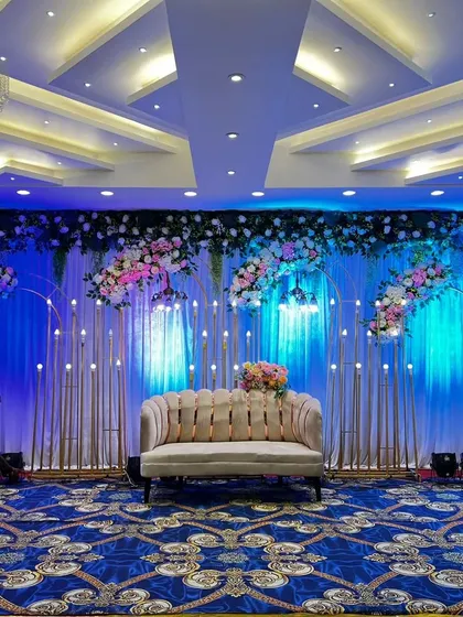 Our team setting up the lighting for a stage at Grand Utsav banquet. We pay close attention to every detail, ensuring the lighting perfectly complements the decor and mood.