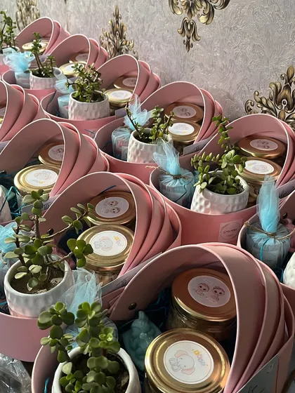 Our cradle hampers are one of our most loved products for baby showers and first birthdays. This order shows them filled with planters and jars, ready for a celebration.