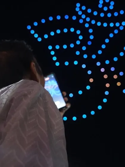 The sacred 'Om' symbol mesmerizes the audience at the Chintpurni Festival. Our shows create a deep spiritual connection, blending technology with faith.