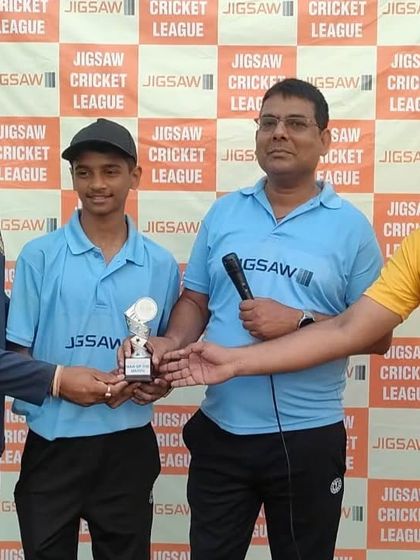 Presenting an award at the Jigsaw Cricket League. Recognizing individual performance is key to building a strong team.