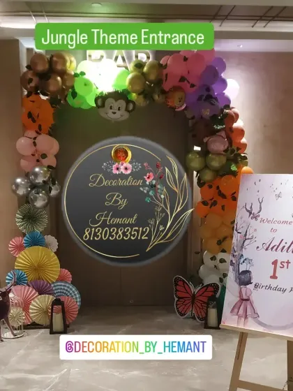 The entrance to a jungle-themed first birthday party. I created a balloon arch with animal print balloons and monkey foils, and placed a personalized welcome easel to greet the guests.