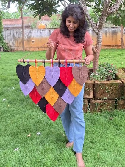 A vibrant cascade of artistry, perfect for nature lovers. This colorful macrame leaf hanging is a great way to add texture, color, and style to your walls.