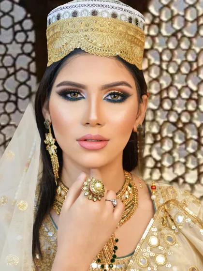 Another portrait of the beautiful Muslim bride, showcasing the complete look with traditional headwear. Our students learn to work with various cultural attires and accessories.