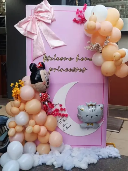 This "Welcome Home Princesses" backdrop was a joy to create for a baby welcome event. I used a custom pink panel with soft pastel balloons, character foils like Minnie Mouse, and a crescent moon detail to make a truly special and memorable entrance.