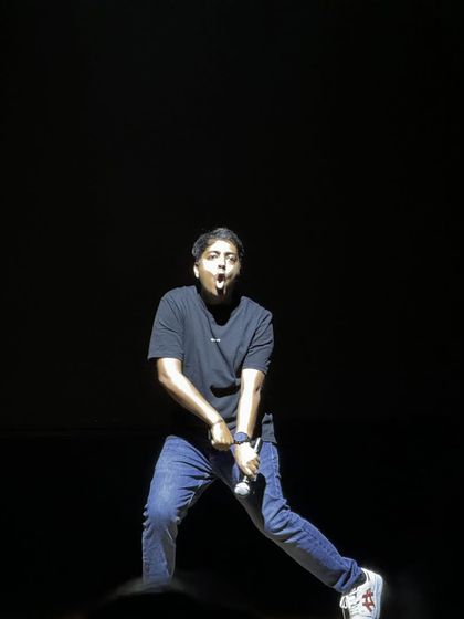 Aakash Gupta's high-energy performance style captured in a single, expressive shot.