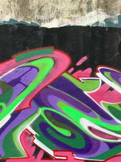 Another detail shot of the same piece, focusing on the smooth color gradients and the clean white highlights that give the letters their form.