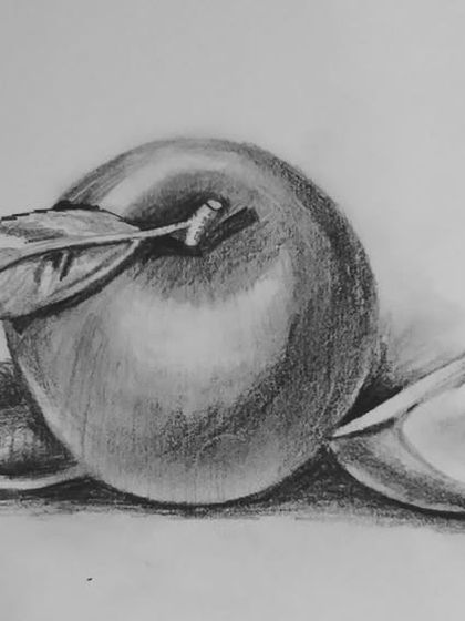 A classic still life of an apple, created with soft graphite pencil shading.