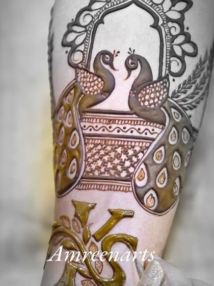 A black and white shot emphasizing the detail in the couple's initials, 'KS', intertwined with foliage.