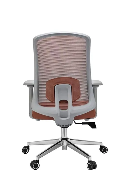 The back view of the pink mesh chair, showing the adjustable lumbar support piece.