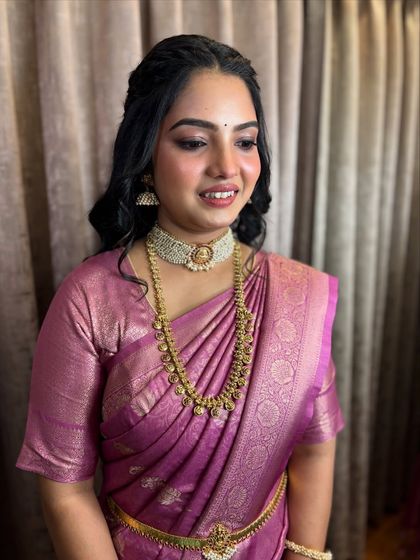 A classic portrait showcasing the elegant jewellery and soft makeup.