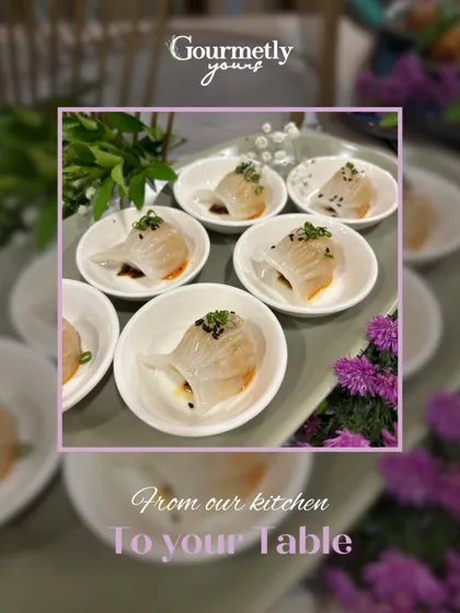 Delicate crystal dim sum served in individual white bowls. This image, part of our "From our kitchen to your table" series, highlights the finesse and fresh flavors of our plated meals.