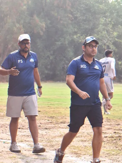 Our management team observing a training session, showcasing their hands-on involvement in the club's development.