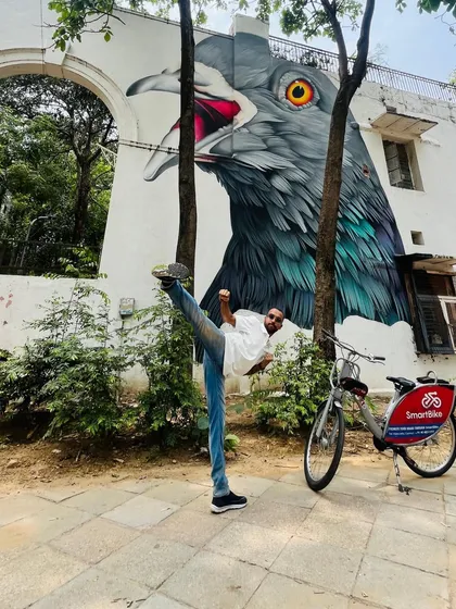 Martial arts is about finding strength and balance everywhere. Here I am practicing a high kick at the Lodhi Art District, blending the discipline of Taekwon-Do with the energy of Delhi.