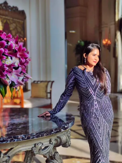 Posing in the magnificent lobby of The Leela Palace. Hosting at such venues requires a certain grace, which I am proud to provide.