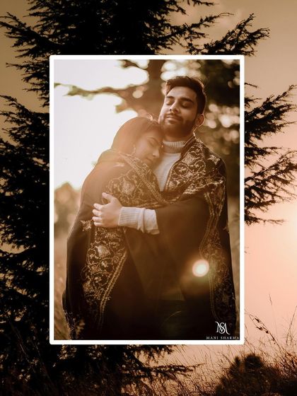 An intimate and cozy portrait from the Shimla pre-wedding shoot. The golden hour light and the warm embrace make this a truly romantic and heartfelt image.