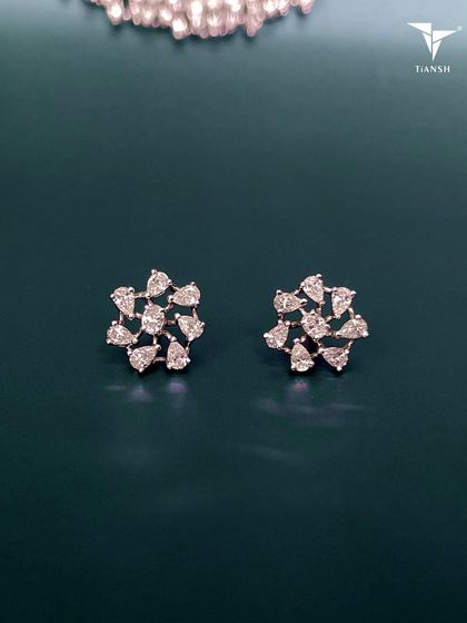 A subtle yet stunning statement. These pear-shaped diamond studs create a unique floral design that is versatile enough to complement any style.
