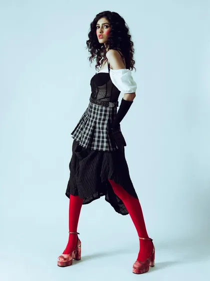A side profile of the doll-like character, showcasing the complete silhouette against a clean background. This is ideal for a designer lookbook.
